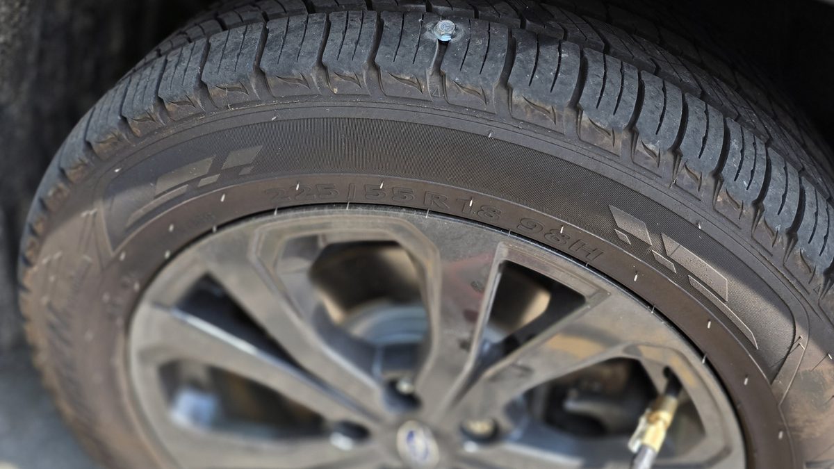 TPMS service by Sparky X — a mounted wheel close-up, its tire pressure sensor checked and serviced