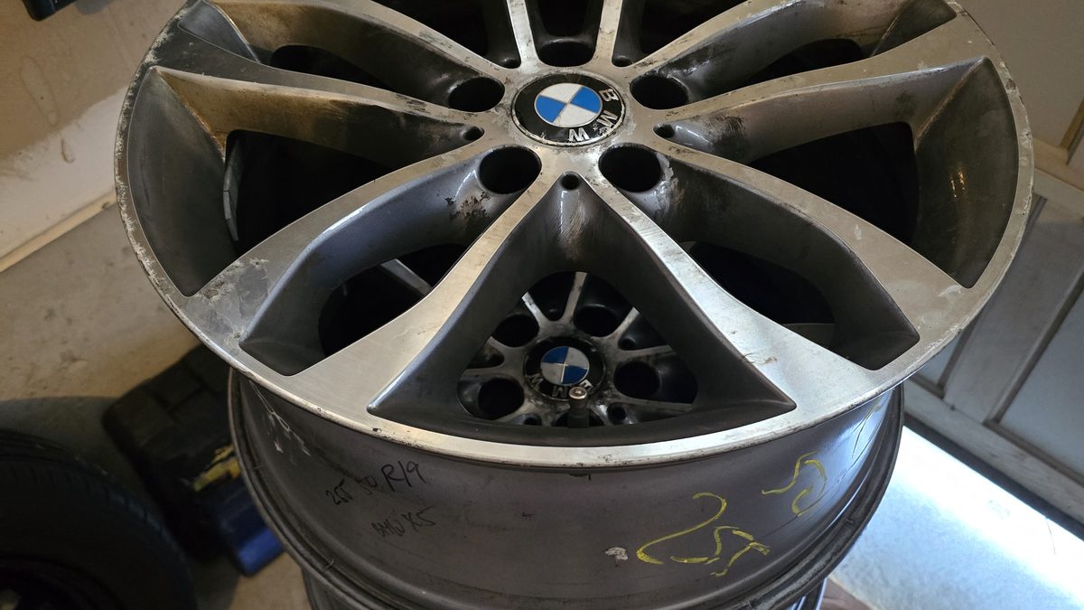 New tires and alloy wheels at Sparky X — a fresh set stacked and ready for free driveway installation